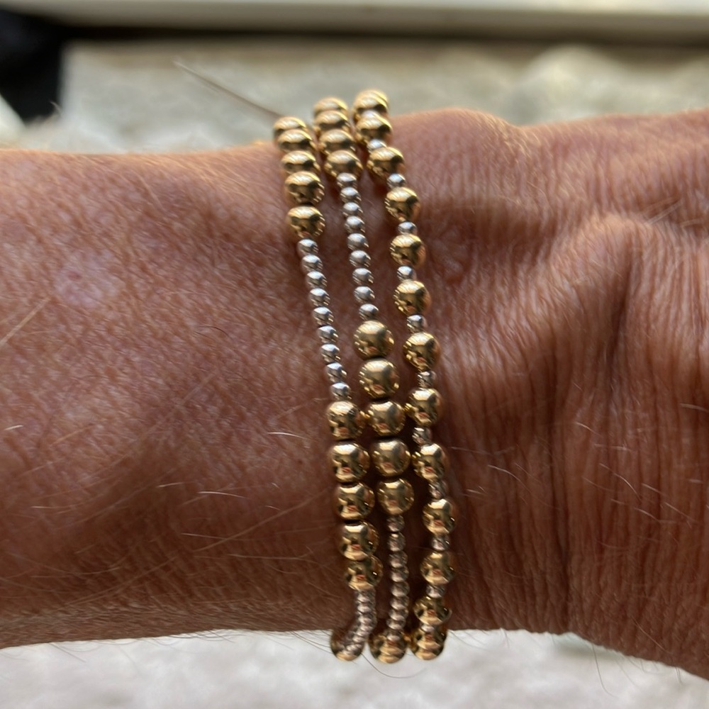 3 e-newton stretchy slip on bracelets.